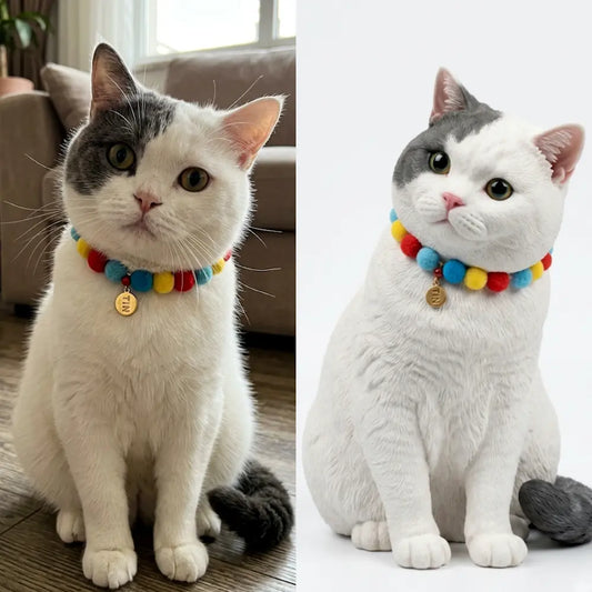 White and gray cat beside its custom 3D pet figurine wearing a colorful collar