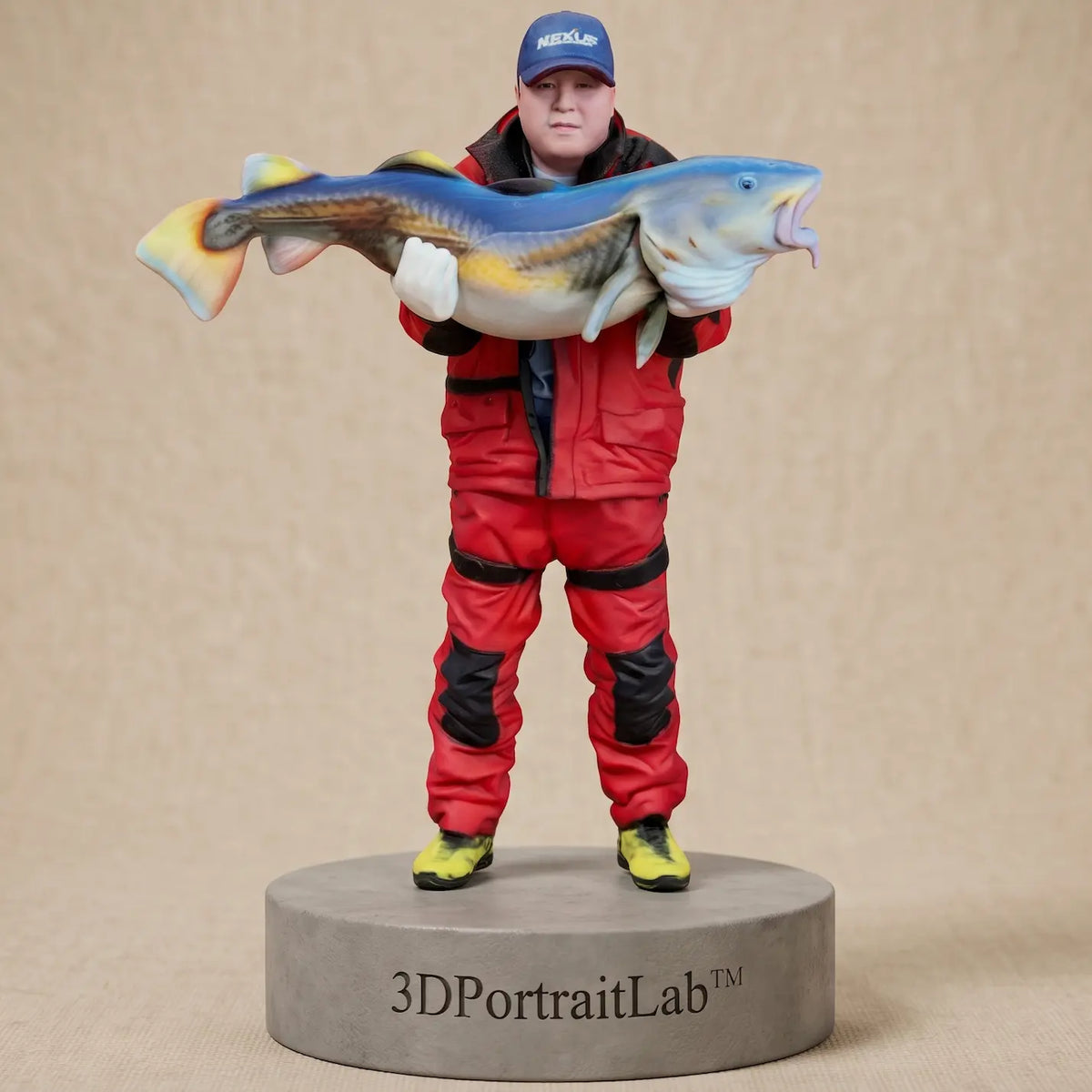 Custom 3D printed full-color figurine of a man in fishing gear holding a large catfish — 3D Portrait Lab