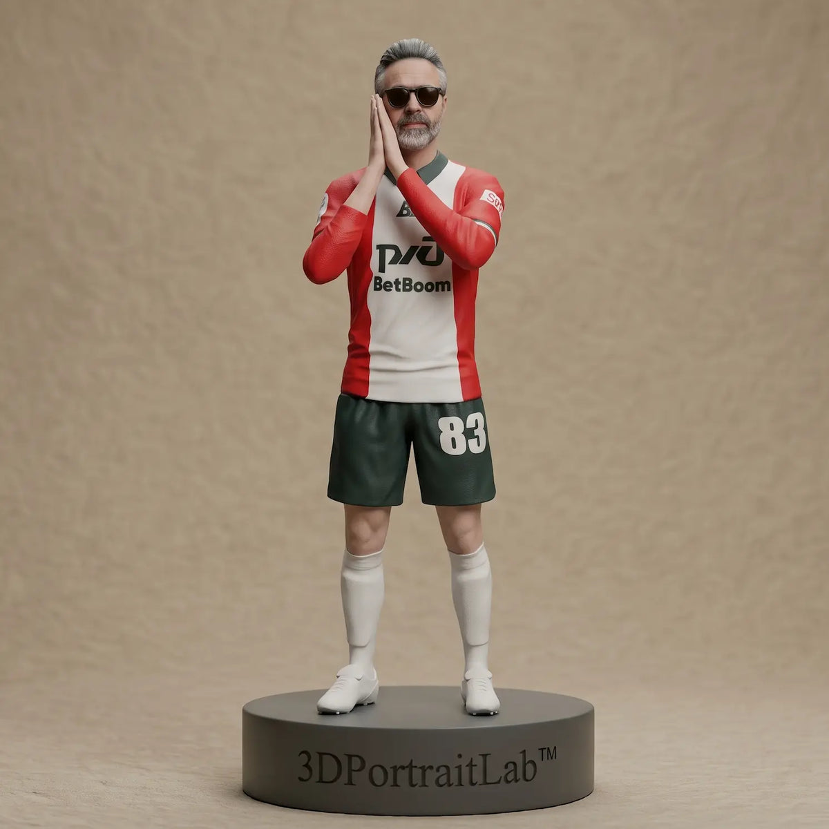 Custom 3D figurine of a man in a red-and-white soccer jersey and sunglasses with his hands pressed together — 3D Portrait Lab