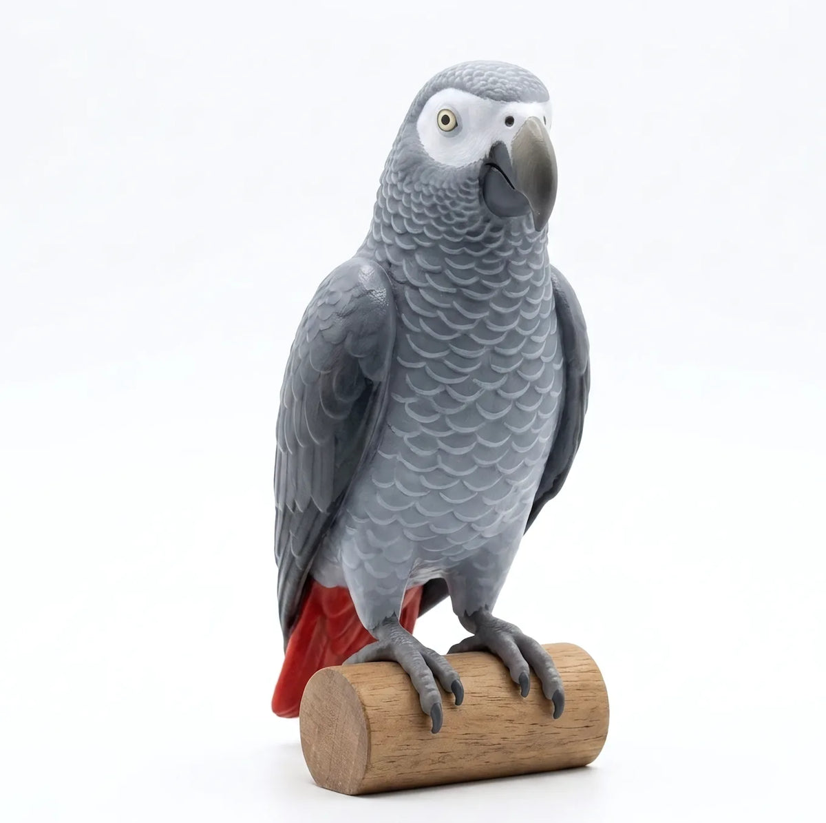 Custom 3D printed figurine of an African grey parrot on a wooden perch, made from the owner’s photos