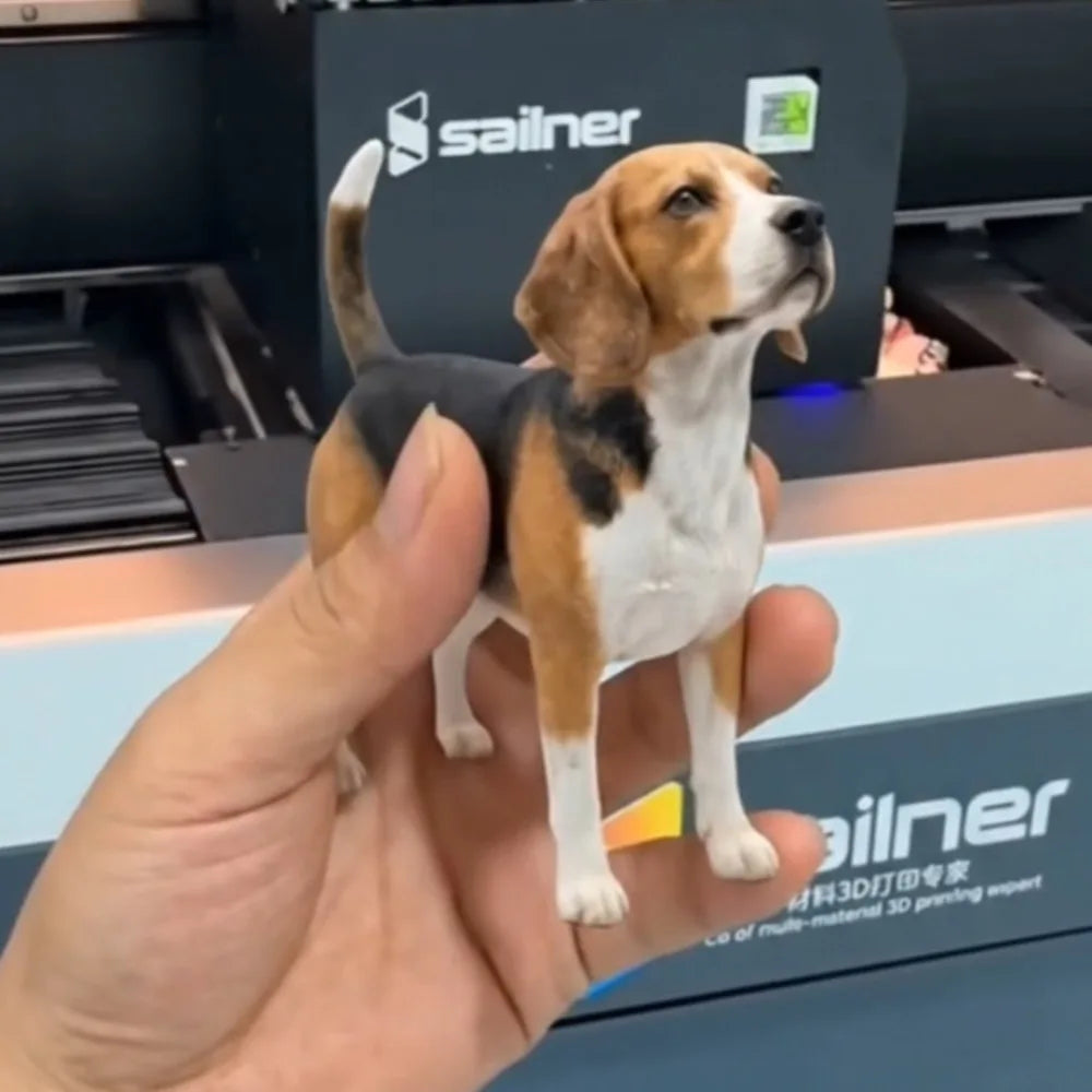 Custom 3D printed beagle figurine held between two fingers to show its real size