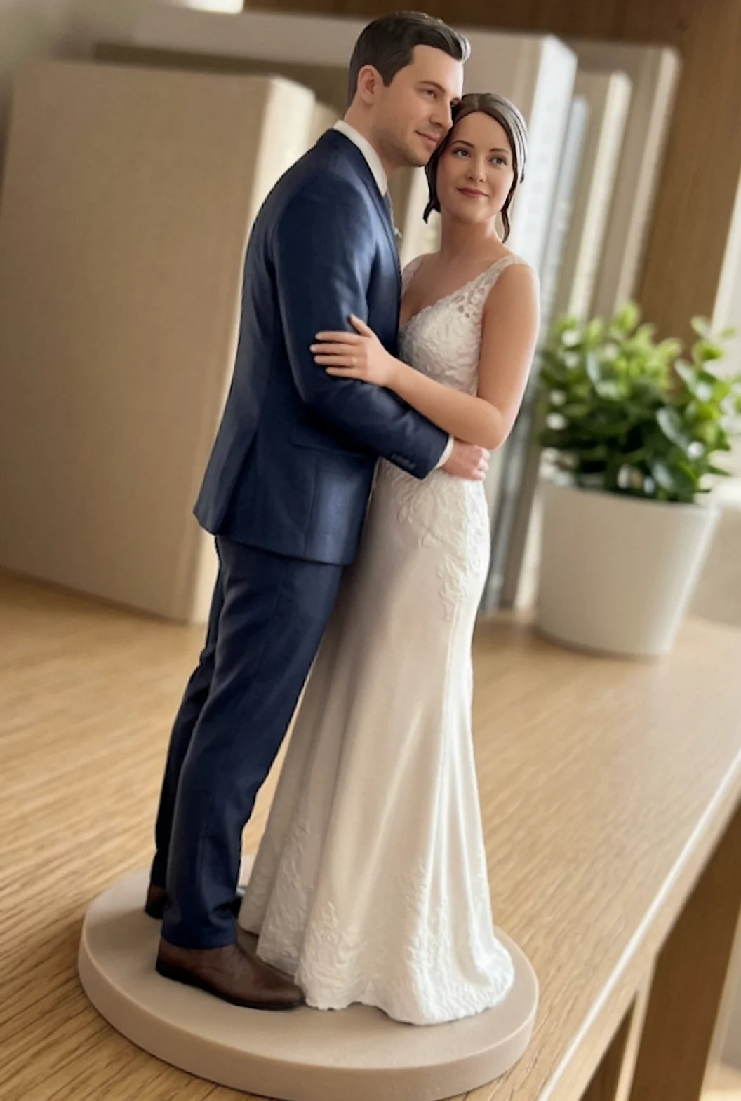 Custom 3D wedding figurine of a couple embracing, displayed on a shelf as a keepsake after the wedding day